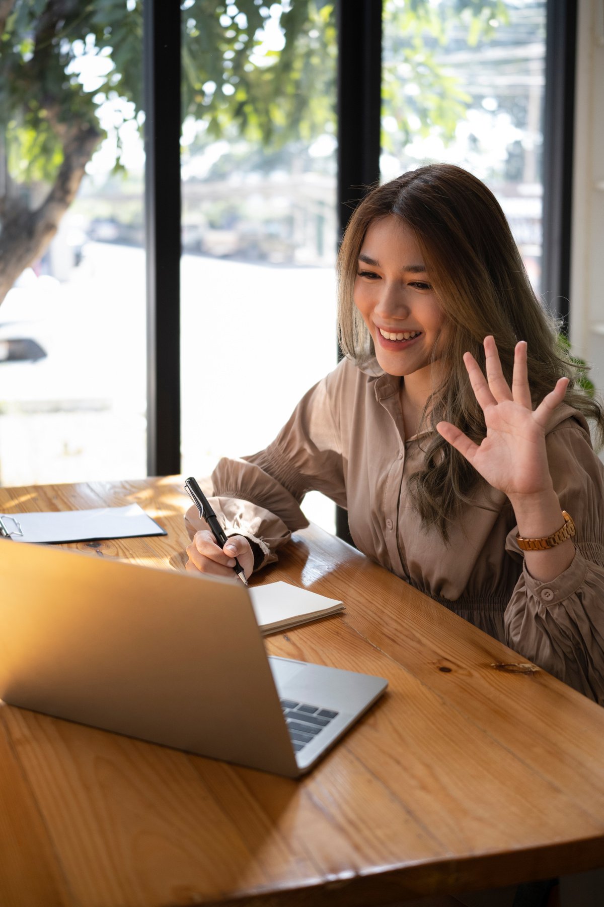 Woman having video conference on laptop computer.